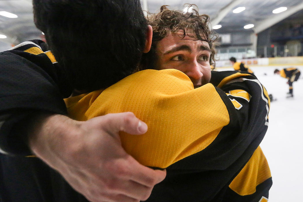 Sports Feature - HMNorthview's Tyler Fredrick (left) hugs Yaqub Elorra after winning the district hockey championship 4-2 against St. John's at the Tam-O-Shanter in Sylvania.(Rebecca Benson / The Blade)